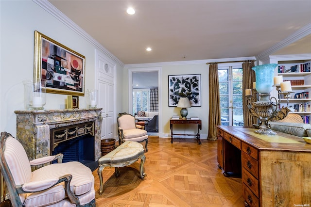 living area featuring light parquet floors and ornamental molding