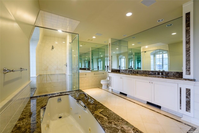 full bathroom featuring tile patterned floors, vanity, toilet, and shower with separate bathtub