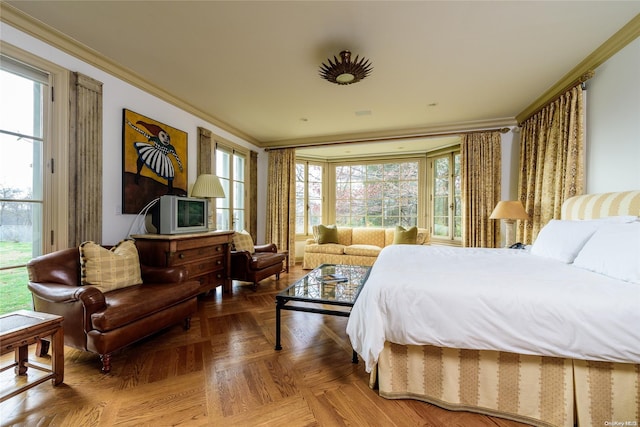 bedroom with parquet flooring, multiple windows, and crown molding