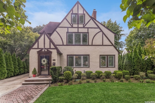 tudor house with a front lawn