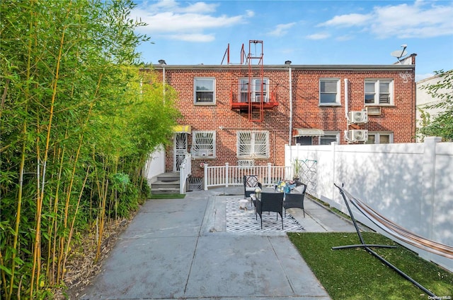 back of house with a patio