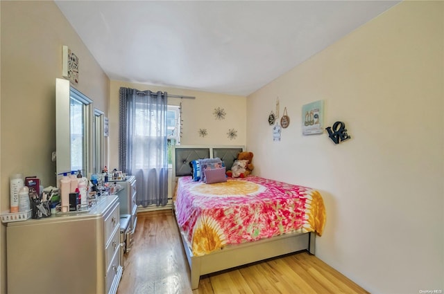 bedroom with light hardwood / wood-style floors