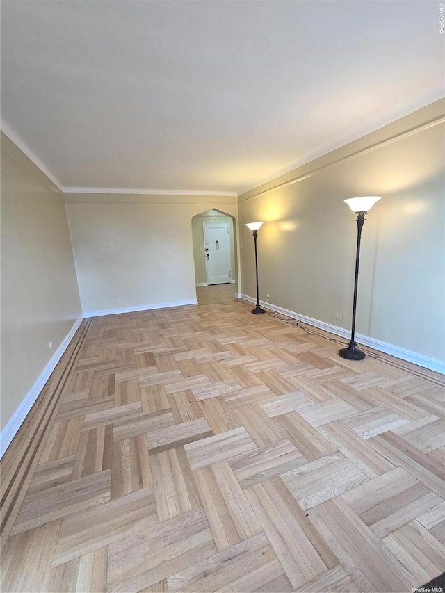 65-41 Booth St Unit 6K, Rego Park, NY 11374 - unfurnished room with arched walkways and baseboards