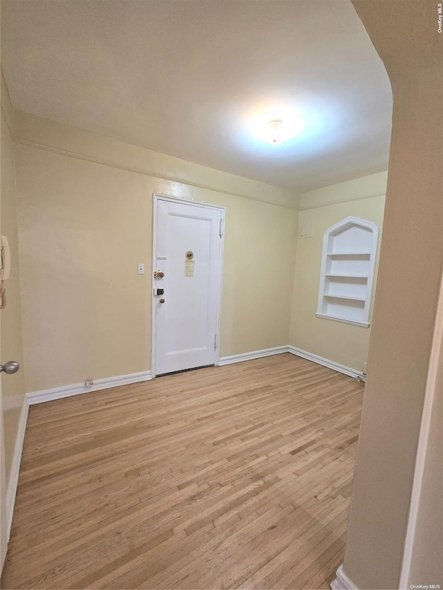 65-41 Booth St Unit 6K, Rego Park, NY 11374 - unfurnished room featuring wood finished floors and baseboards