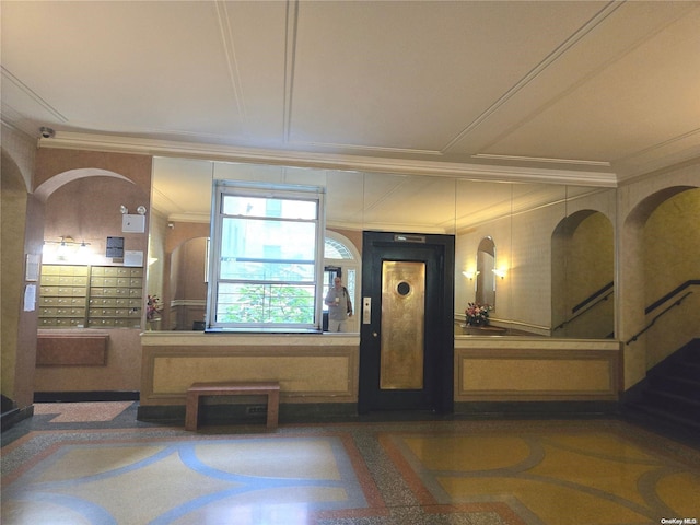 entryway with mail boxes and ornamental molding