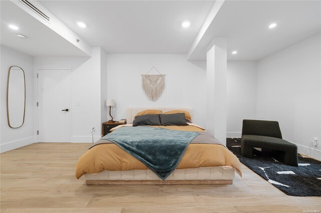 bedroom with light hardwood / wood-style flooring