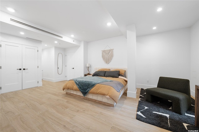 bedroom with light hardwood / wood-style floors