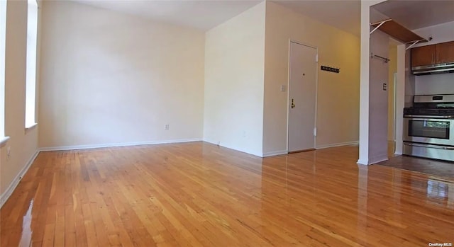 unfurnished room with light hardwood / wood-style floors