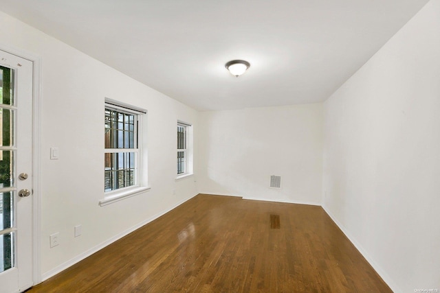 empty room featuring hardwood / wood-style flooring