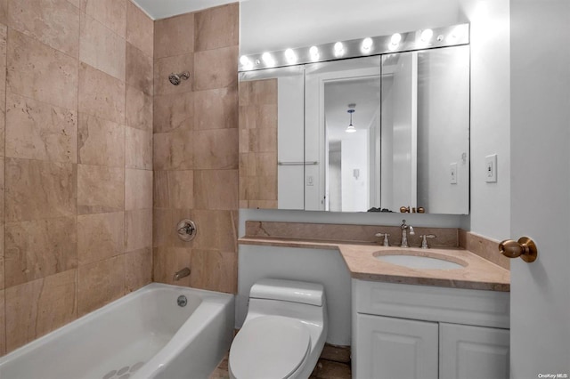 full bathroom with tiled shower / bath combo, toilet, and vanity