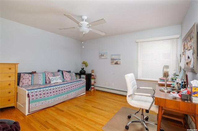 bedroom featuring baseboard heating, ceiling fan, and hardwood / wood-style flooring