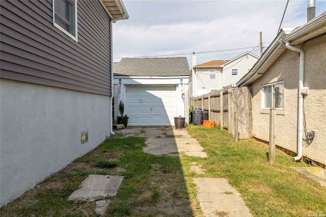 view of yard with a garage