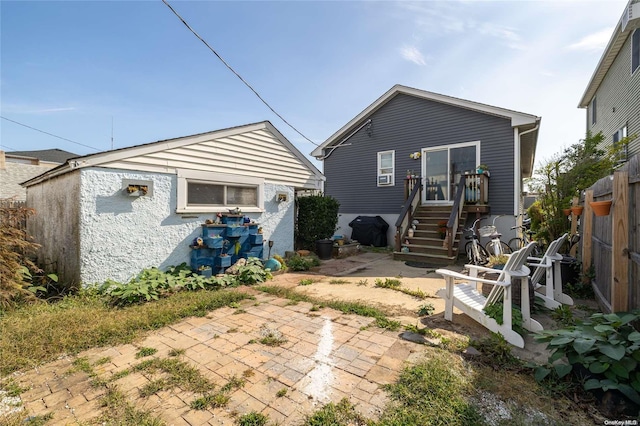 back of property featuring a patio