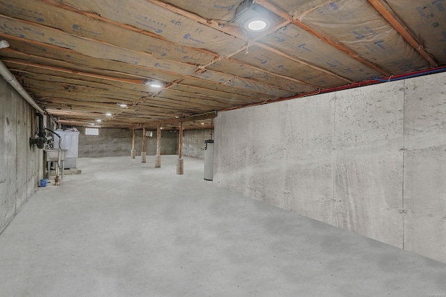 unfinished basement with water heater