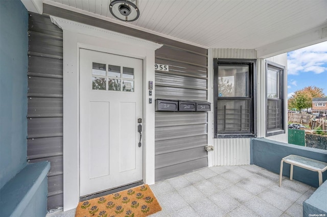 doorway to property with a porch