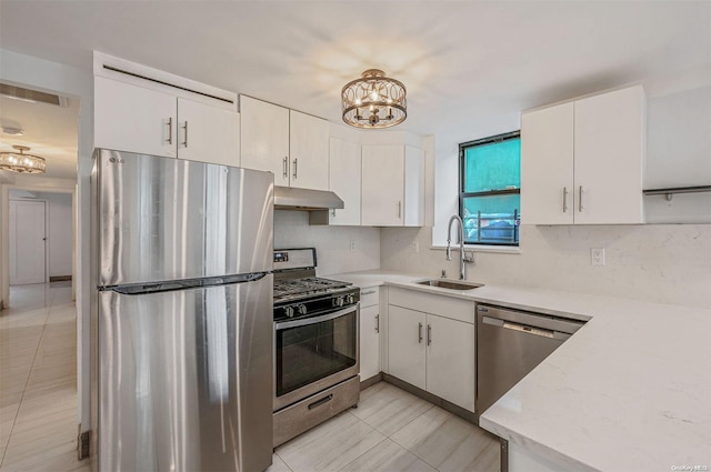 kitchen featuring white cabinetry, sink, and appliances with stainless steel finishes