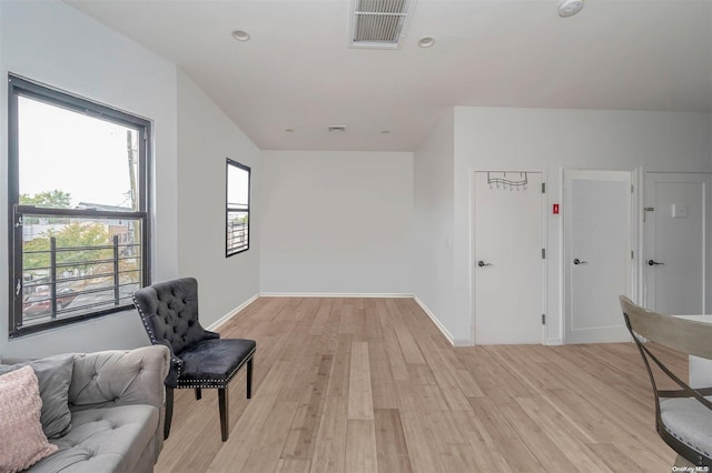 sitting room with light hardwood / wood-style floors