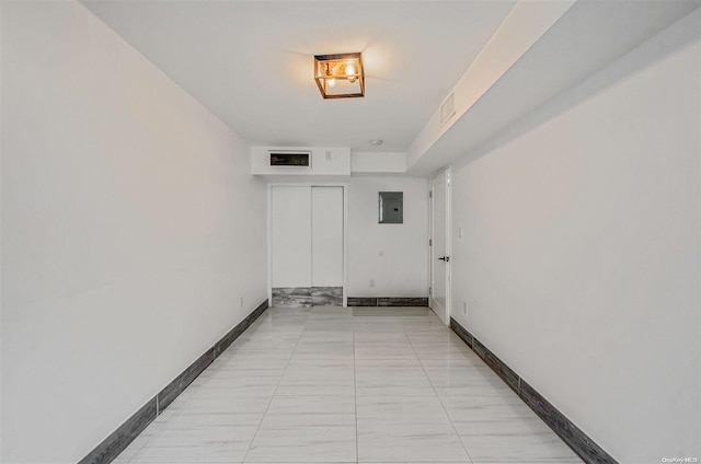 corridor with light tile patterned floors