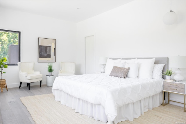 bedroom with light wood-type flooring