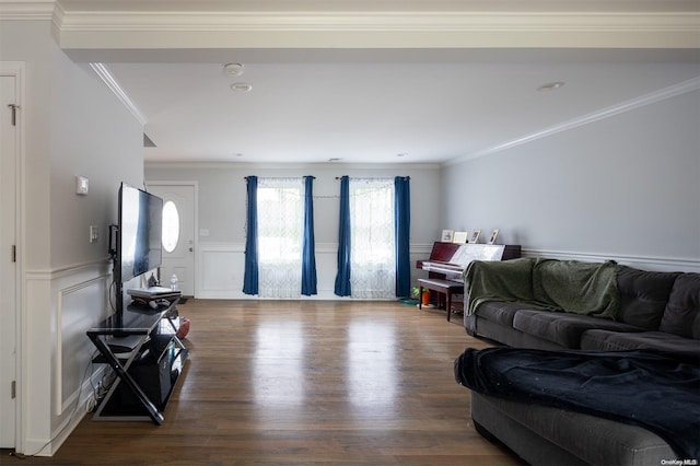 living room featuring wood-type flooring and ornamental molding