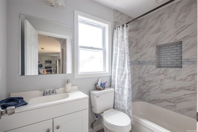 full bathroom featuring vanity, shower / bath combination with curtain, and toilet