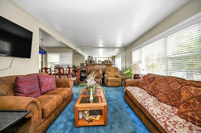 living room with plenty of natural light and carpet floors