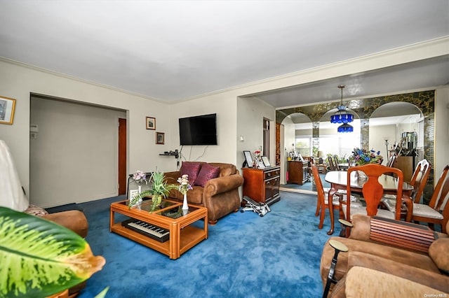 carpeted living room with ornamental molding