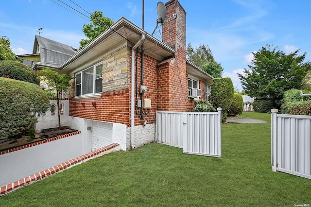 view of side of property with cooling unit and a lawn