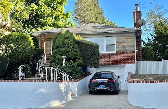 view of front of property with a garage