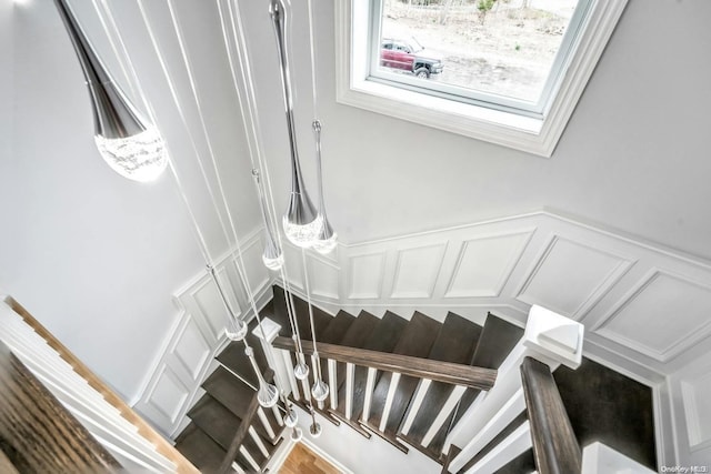 stairway with hardwood / wood-style flooring