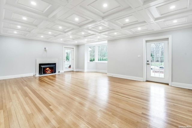 unfurnished living room with a fireplace, light wood-type flooring, and coffered ceiling