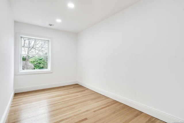 spare room featuring light hardwood / wood-style floors