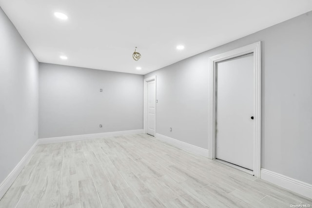 unfurnished room featuring light hardwood / wood-style floors