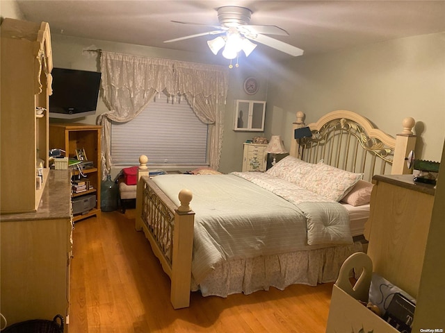 bedroom featuring ceiling fan and wood-type flooring