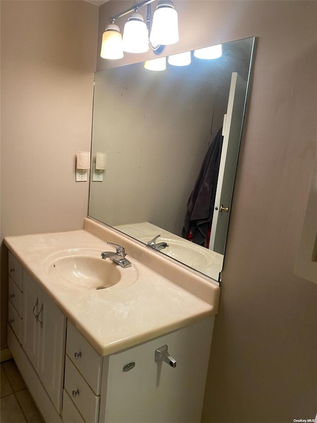 bathroom featuring tile patterned flooring and vanity