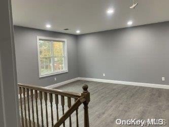 empty room featuring hardwood / wood-style floors