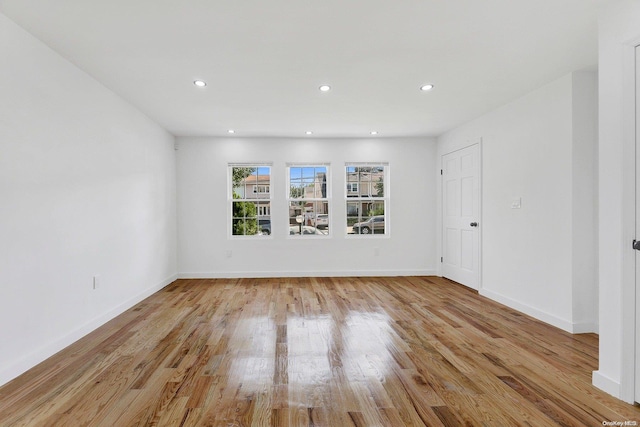 unfurnished room with light hardwood / wood-style flooring