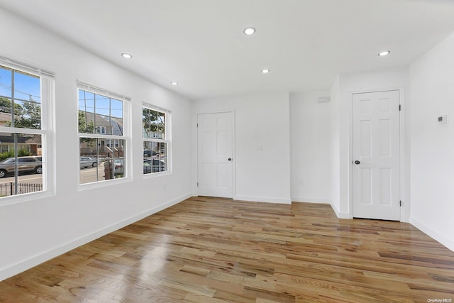 spare room with light wood-type flooring