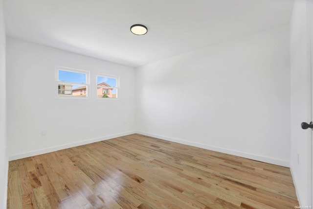 empty room with light hardwood / wood-style floors