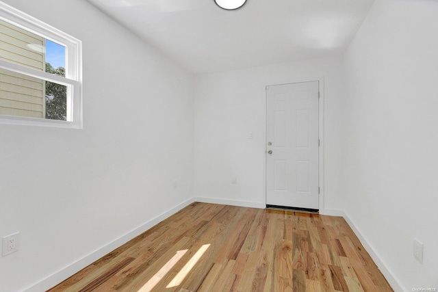 spare room with light wood-type flooring