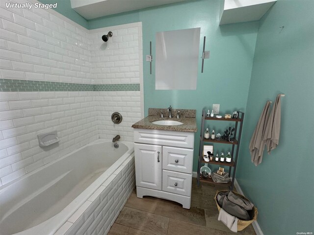 129 Bch 118th St Unit 6F, Rockaway Park, NY 11694 - bathroom featuring vanity, tiled shower / bath combo, and tile patterned flooring