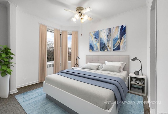 bedroom with carpet, ceiling fan, and crown molding