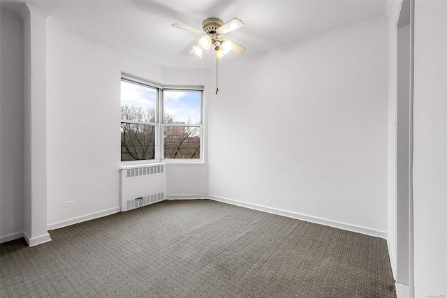 carpeted empty room with radiator heating unit and ceiling fan