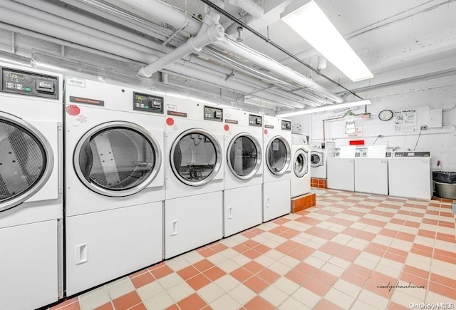 clothes washing area with washer and dryer