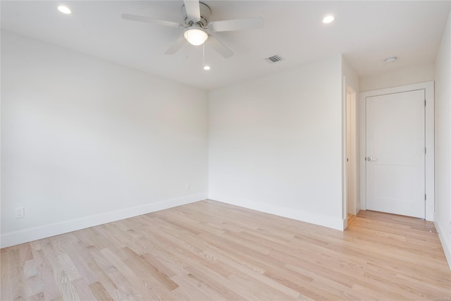 unfurnished room featuring ceiling fan and light hardwood / wood-style flooring