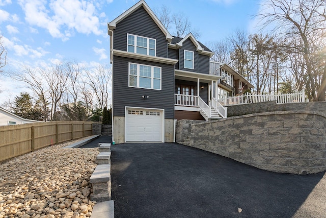 view of front of home with a garage and a porch