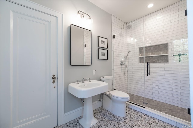 bathroom featuring toilet, tile patterned flooring, and walk in shower