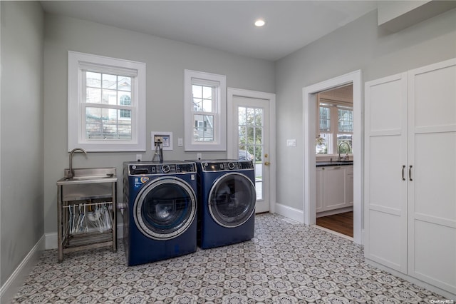 laundry room featuring washer and clothes dryer and sink