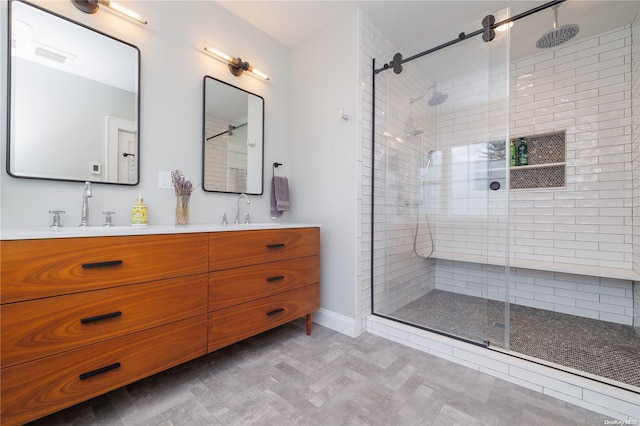 bathroom featuring vanity and an enclosed shower