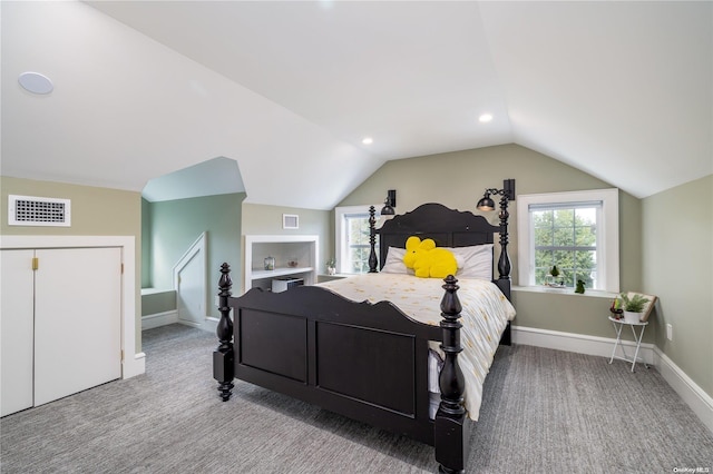 carpeted bedroom with vaulted ceiling